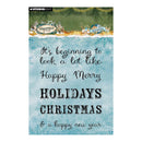 A Studio Light Christmas card with a watercolor blue background, black cursive and block lettering that reads 'It's beginning to look a lot like Happy Merry HOLIDAYS CHRISTMAS & a happy new year', with a green pine-treetop border and small holiday illustrations at the top.