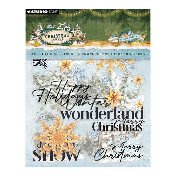 Studio Light 'Christmas Wonderland' A6 scrapbooking sticker sheets featuring winter forest designs, snowflakes, stars, and festive text on a light blue background.