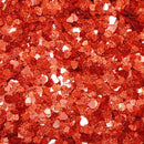 Red glittery confetti with a close-up view