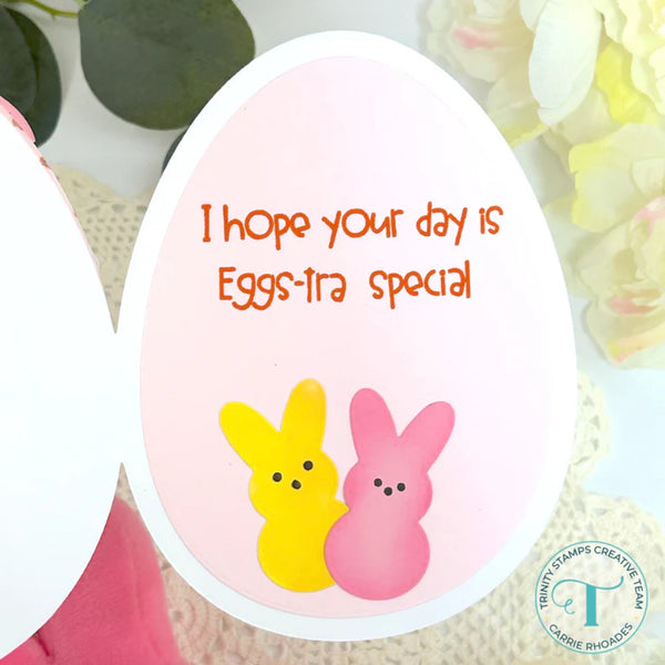 Easter egg-shaped card with bunnies and text on a floral background