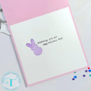 Greeting card with a purple bunny and text 'Wishing you an egg-cellent day' on a white background.