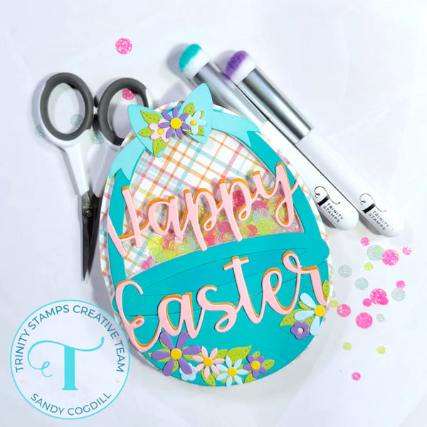 Decorative Easter sign with 'Happy Easter' text, scissors, and markers on a white background.