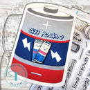 Card with a battery design and 'Stay Positive' text on a wooden surface with stamping tools.