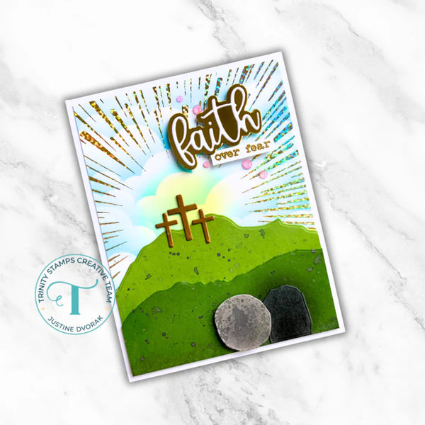 Card with 'Faith over fear' text and cross design on a white marble background