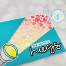 Card with heart pattern and 'big squishy hugs' text, featuring a logo in the corner.
