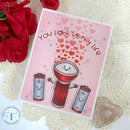 Card with cartoon light bulb and batteries on a pink background with hearts, surrounded by red roses.