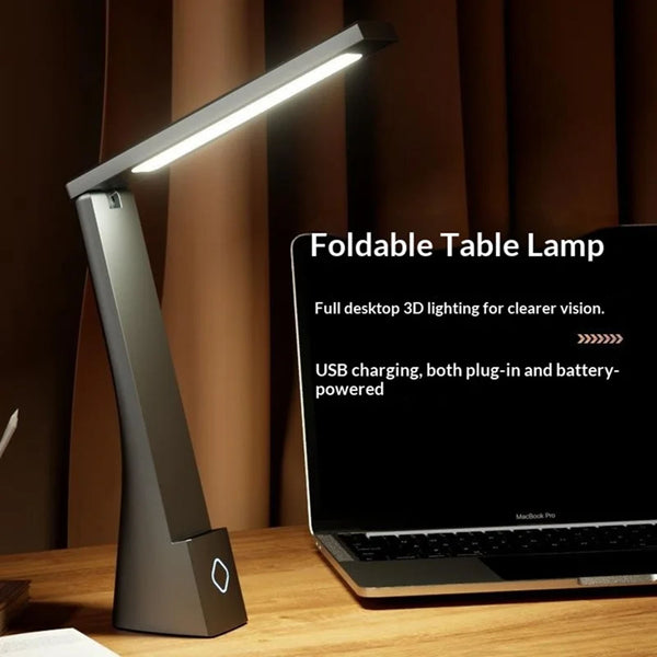 Foldable table lamp on a desk next to a laptop with product details.