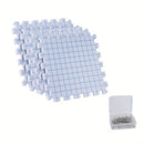 Grid-patterned foam puzzle tiles with a small container of nails on a white background