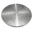 Metallic disc with concentric circular patterns on a white background