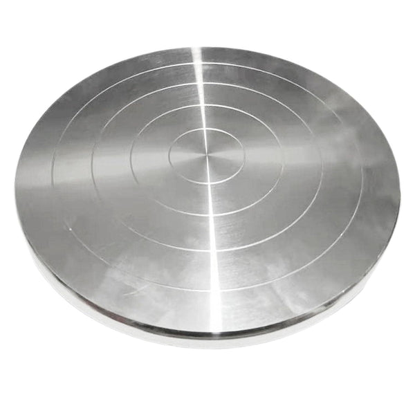 Metallic disc with concentric circular patterns on a white background