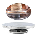 Rotating cake stand with a close-up inset showing stacked cakes.