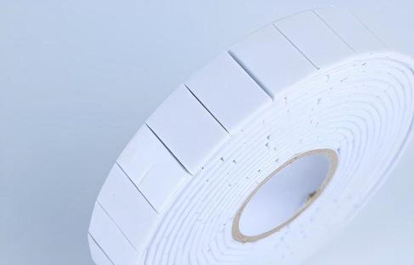 Roll of white paper on a light blue background