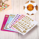 Set of decorative stencils with various shapes on a wooden surface.