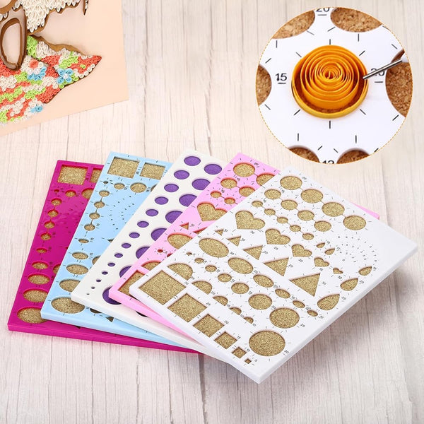 Set of decorative stencils with various shapes on a wooden surface.