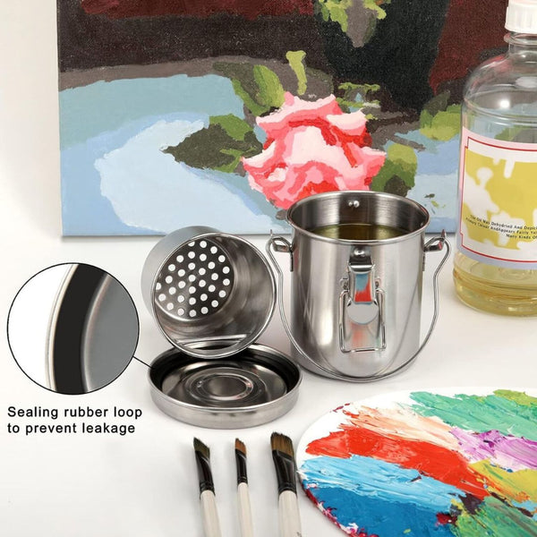 Metal paint can with lid, brushes, and a colorful painting in the background