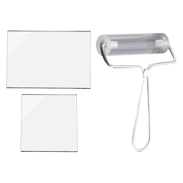 Clear plastic roller with handle and two white sheets on a white background