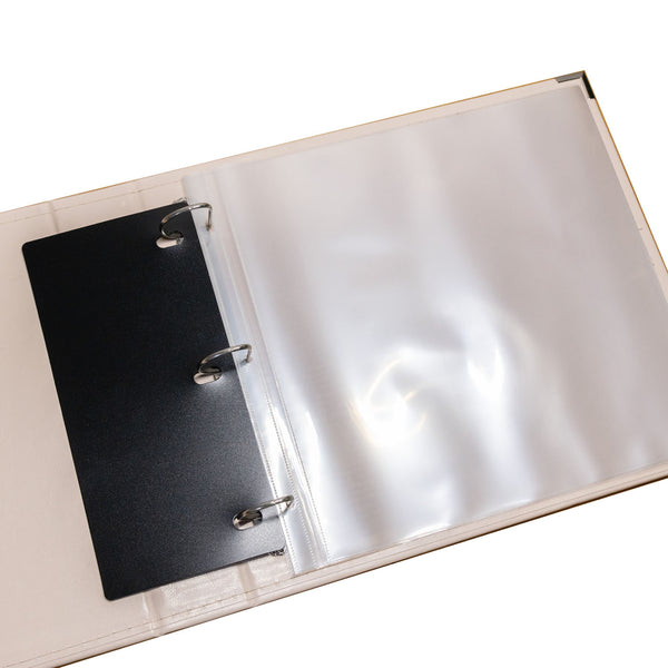 Open ring binder with a black page and clear plastic cover on a white background