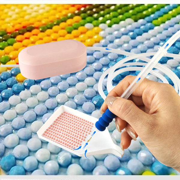 Hand holding a pool cleaning tool over colorful ball pit balls