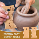 Person using a pottery foot shaper tool on a clay pot with a blurred background