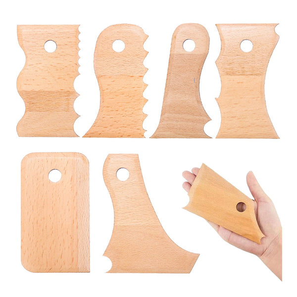 Set of wooden tools with a hand holding one, on a white background