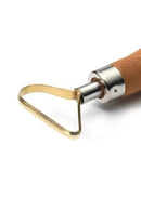 Metallic tool with wooden handle on a white background