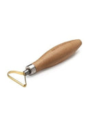 Skincare tool with wooden handle and gold metal edge on a white background