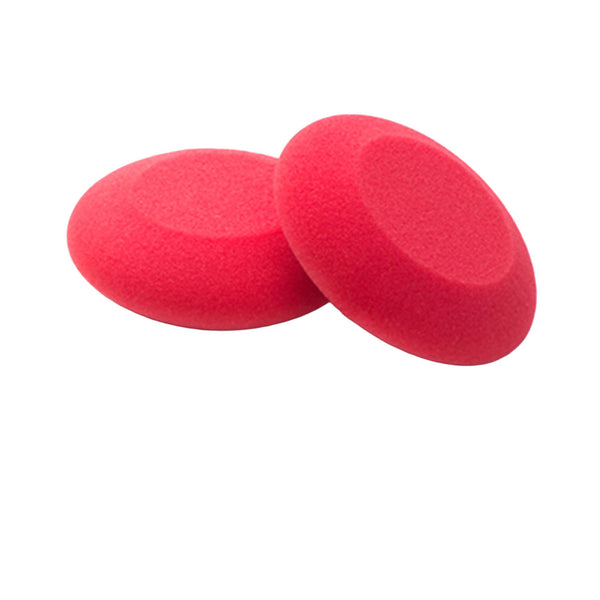 Two red foam sponges on a white background