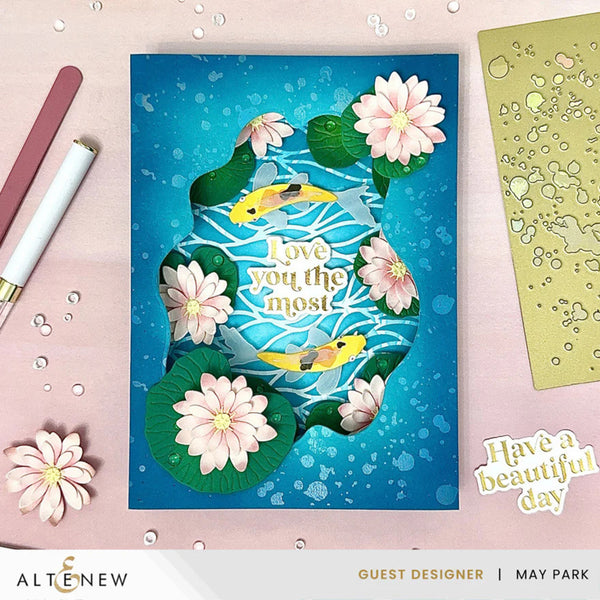 Greeting card with fish and flowers design on a blue background, featuring the brand 'Altenew'.