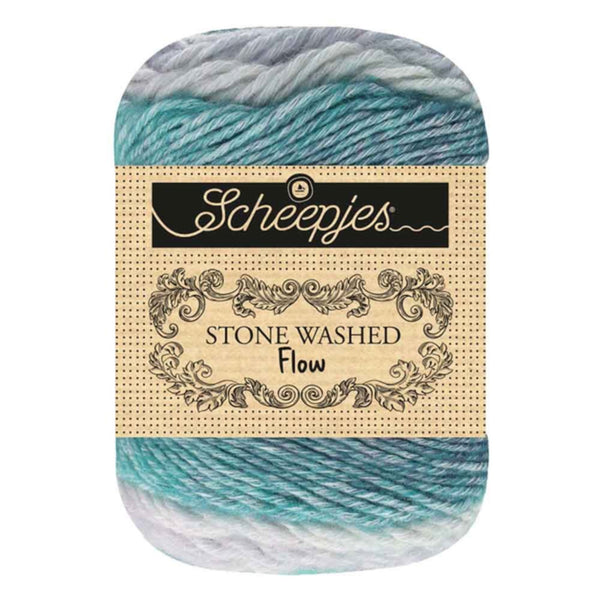 Skein of yarn with a Scheepjes label on a white background