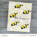 Card with bee illustrations and 'we bee-lieve in you' text on a textured background