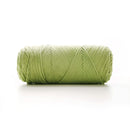 Green skein of yarn on a white background