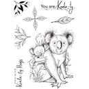 Black and white illustration of a koala and baby with decorative leaves and text on a white background