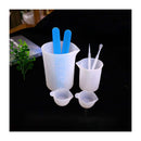 Set of silicone molds with blue and white tools on a black background