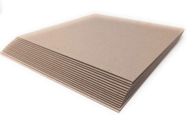 Stack of brown cardboard sheets on a white background