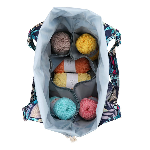 Backpack with colorful yarn balls inside on a white background