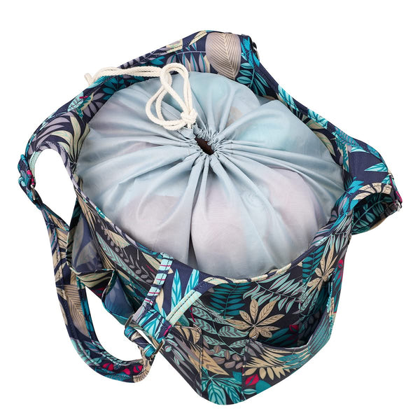 Drawstring bag with floral pattern containing a light blue ball on a white background