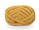 Large ball of mustard yellow yarn on a white background