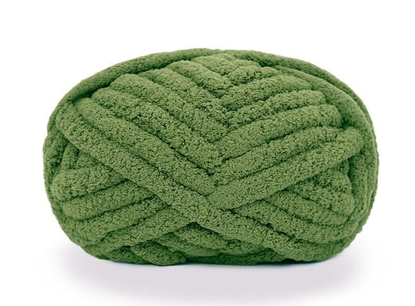 Green textured ball of yarn on a white background