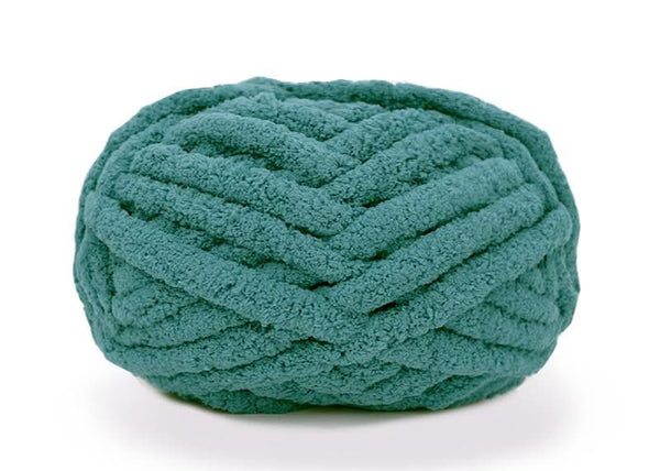 Teal skein of yarn on a white background