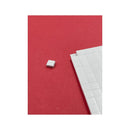 White square tile on a red background