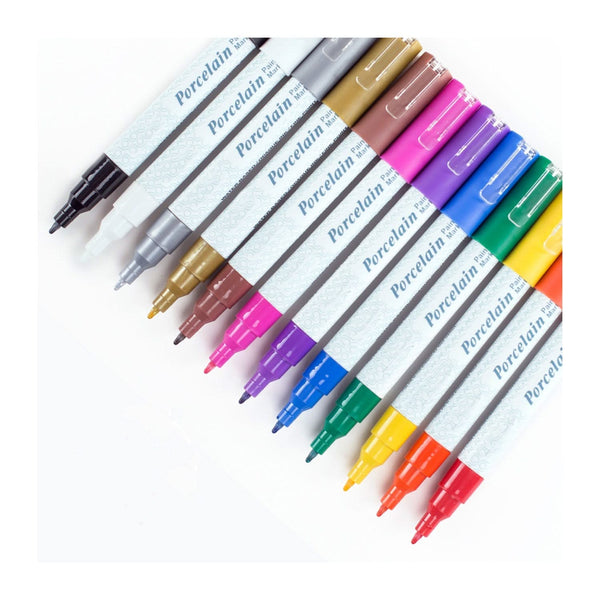 Set of Porcelain markers in various colors on a white background